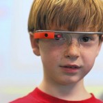 Google Glass. First-grader Peter Eiswert uses Google Glass to record pictures and video during el día de las naciones unidas en la St. James Academy